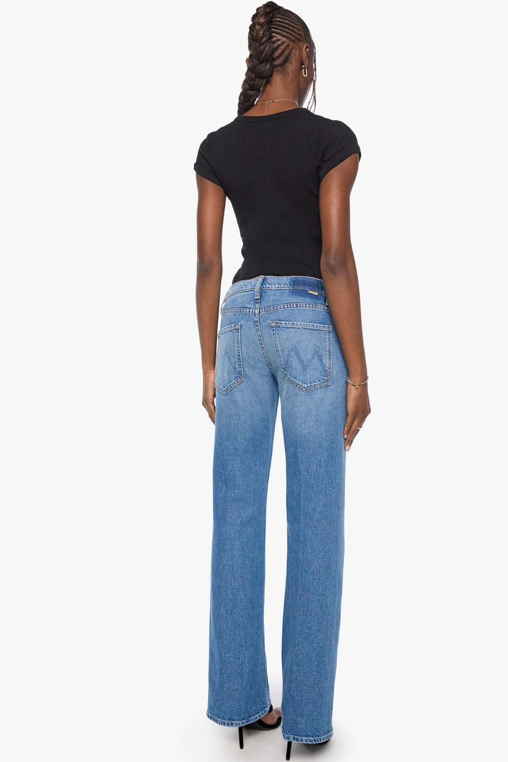 Model wearing Mother Denim The Bookie Twist Skimp rear view