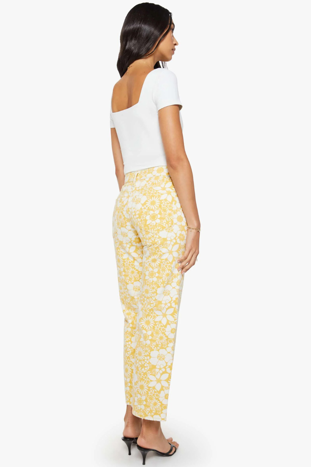 Model wearing Mother Denim The Mid Rise Rambler Zip Ankle rear view