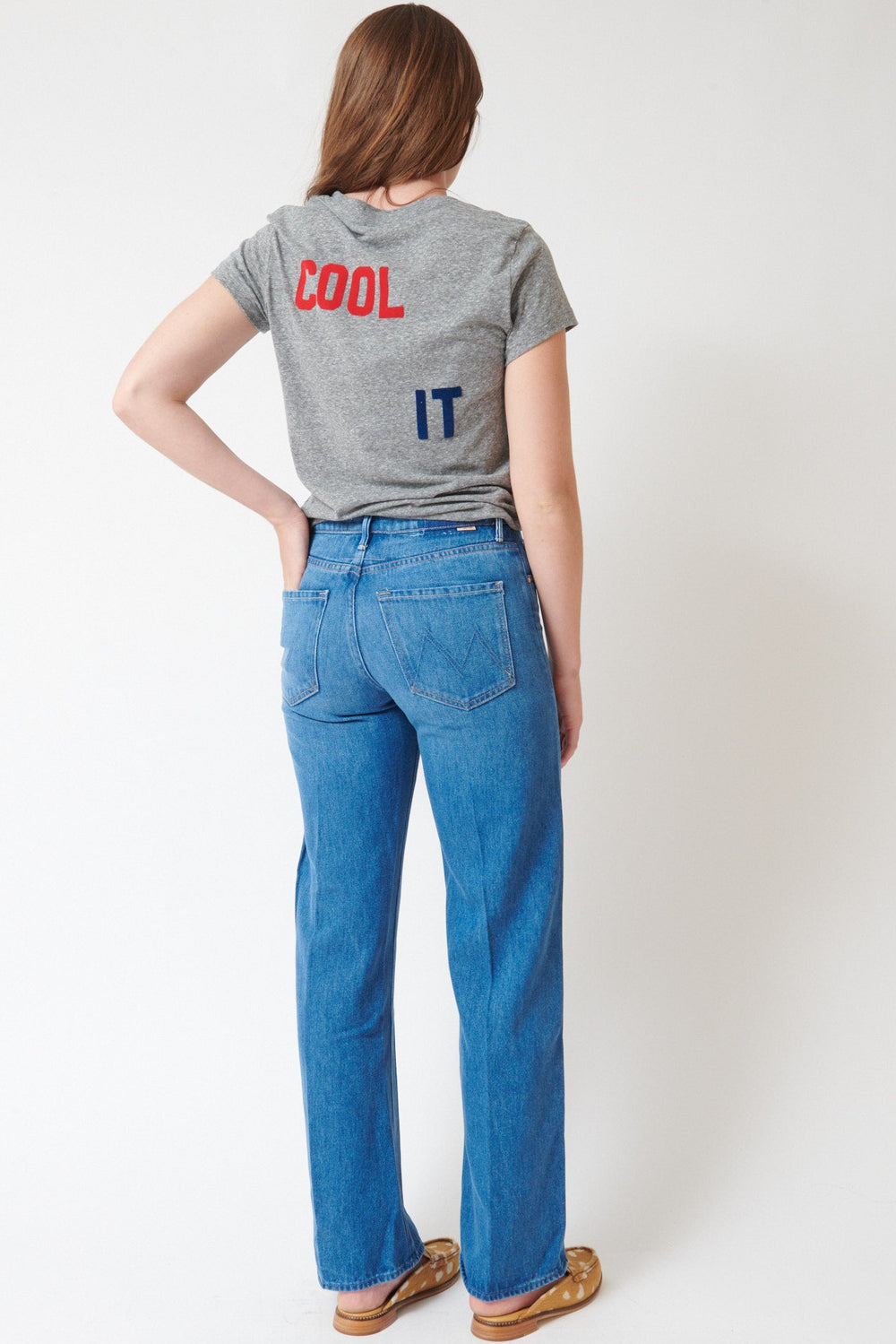 Julia wearing Mother Denim The Mid Rise Lasso Sneak rear view