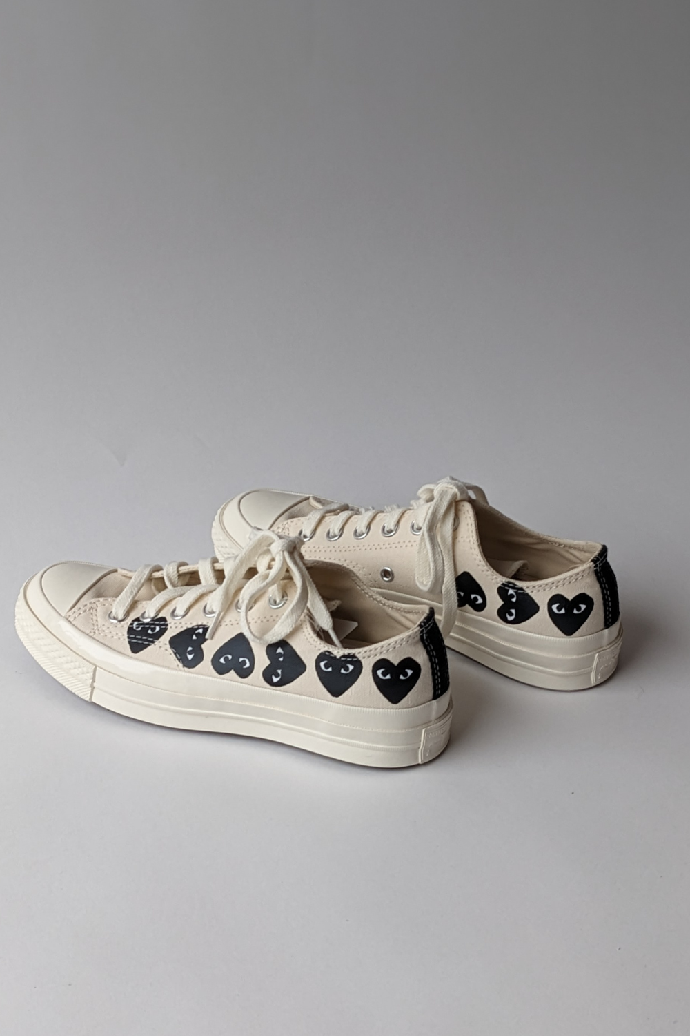 Back, side view of Comme des Garçons PLAY Multi Heart Converse Chuck Taylor Low Top