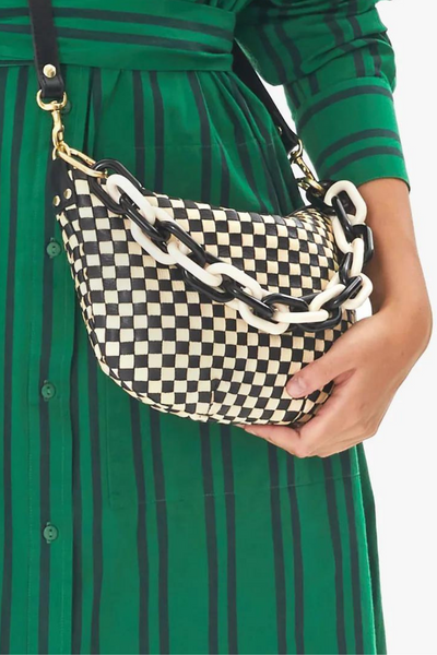 Clare V. Shortie Strap on a bag being held by a model