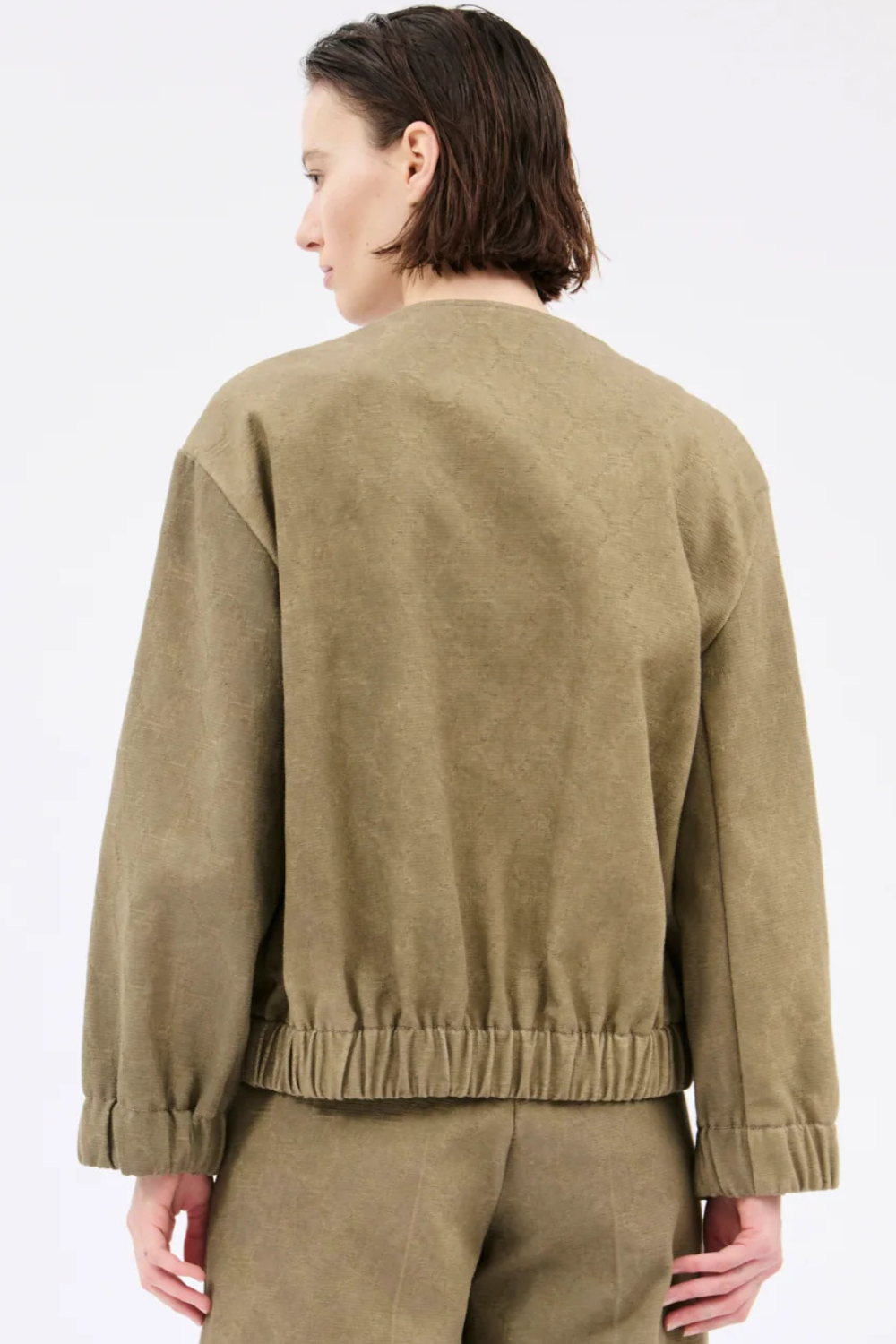 Model wearing Odeeh Cotton Damask Bejeweled Zip Jacket rear view