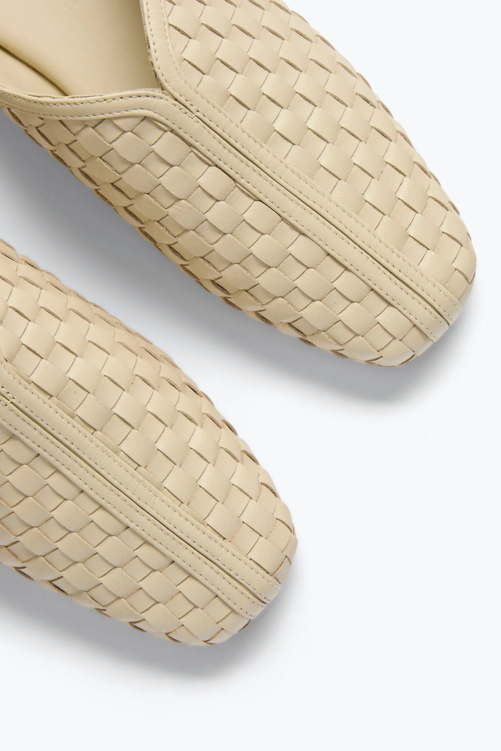 Flat lay of Frēda Salvador Saanvi Flat Mule Vanilla Woven Calf top view