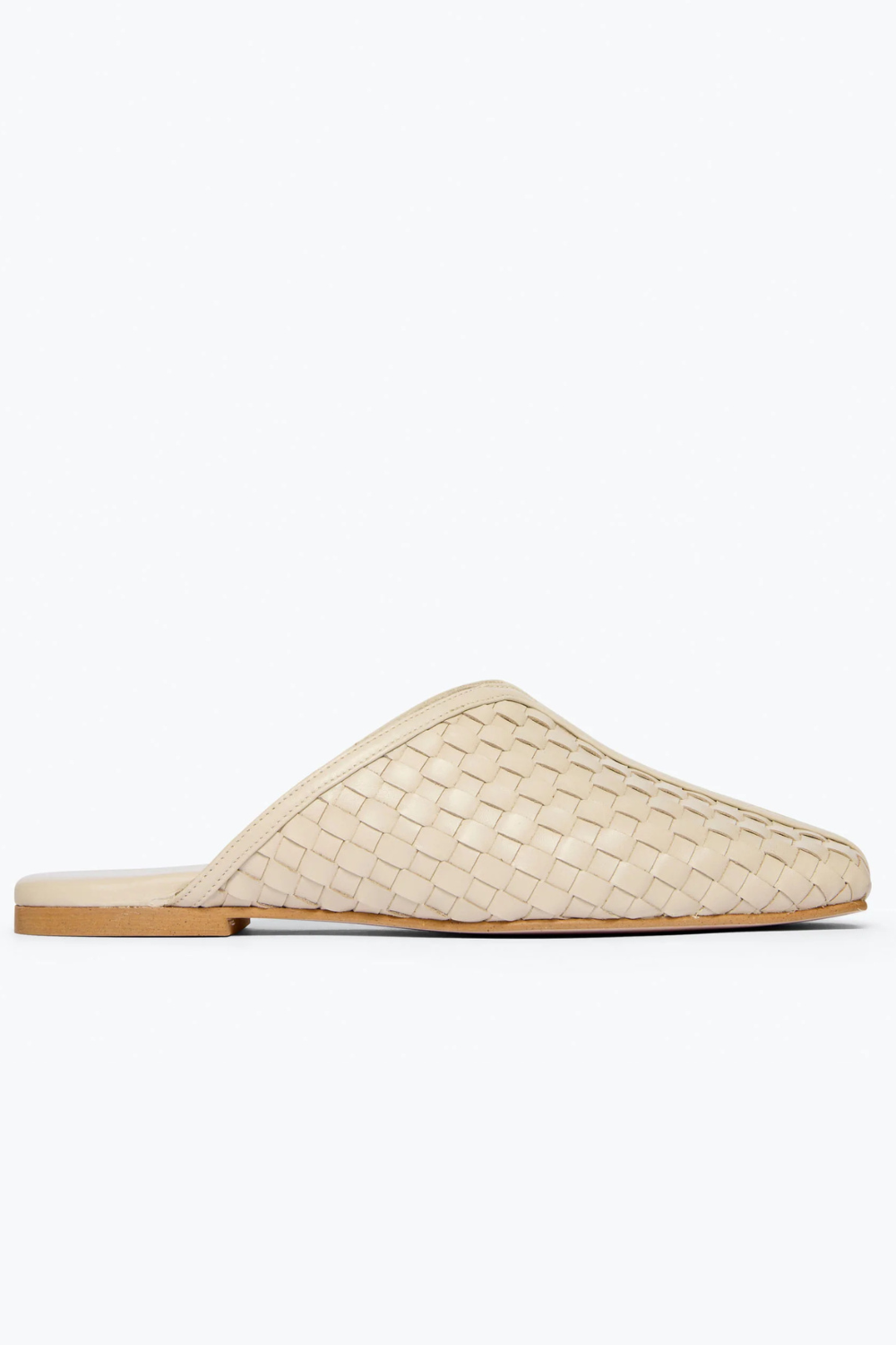 Flat lay of Frēda Salvador Saanvi Flat Mule Vanilla Woven Calf side view