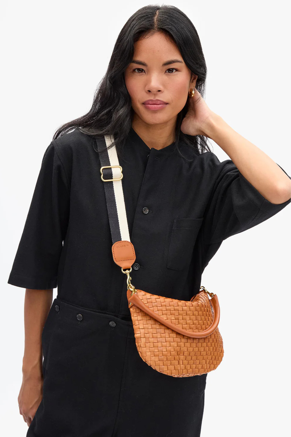 Model wearing Clare V. Adjustable Crossbody Strap Black Cream Two Tone Webbing front view