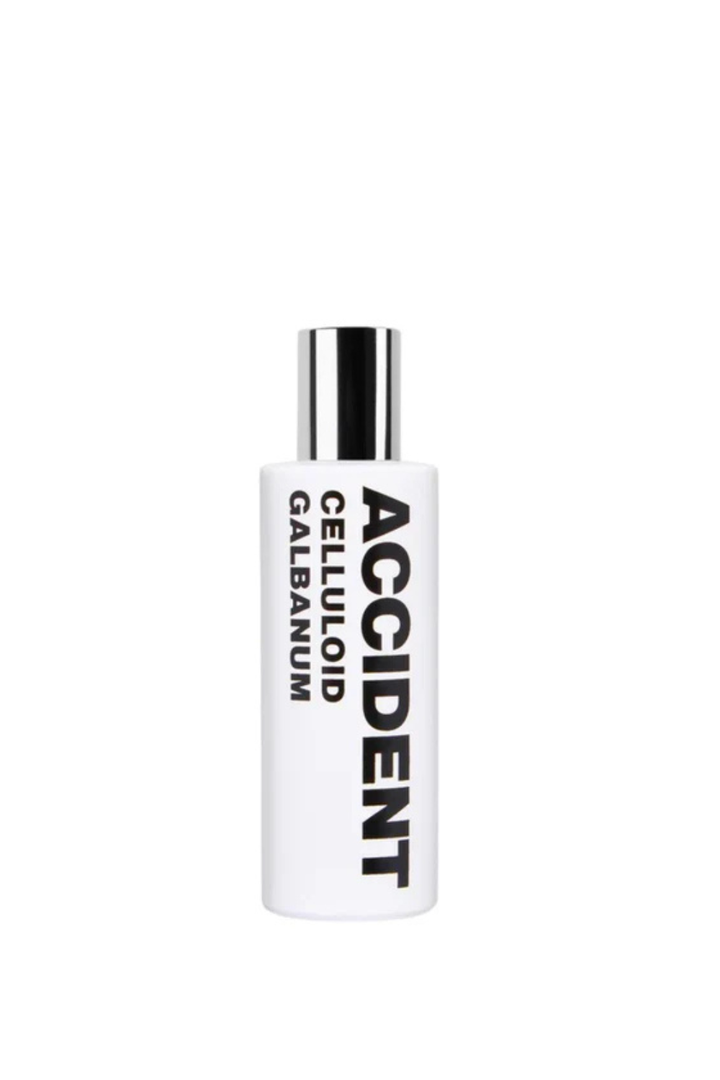 Flat lay of Comme des Garçons Eau de Parfum ACCIDENT Celluloid Galbanum front bottle view