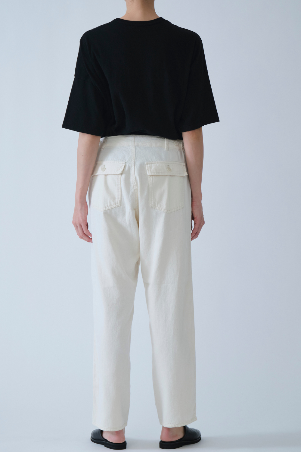 Model wearing Pas de Calais 8oz Natural Denim Baker Pants rear view