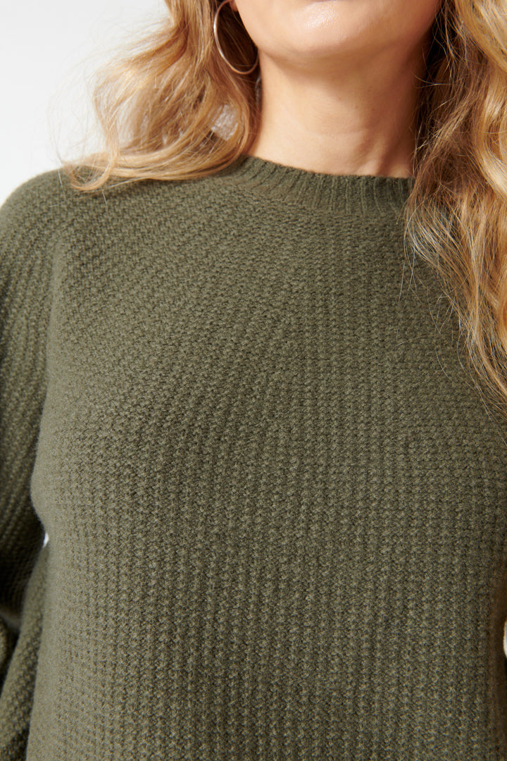 Mari wearing Pas de Calais Cashmere Blend Lambs Wool Patterned Knit Crewneck Pullover Khaki front detail view