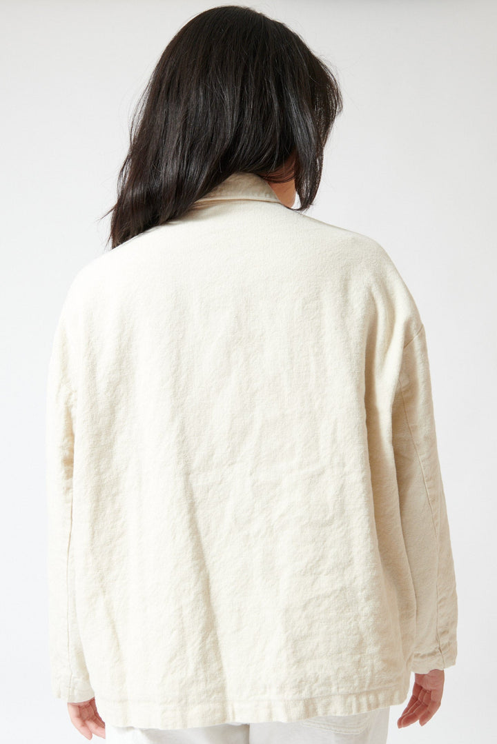 Lilly wearing Pas de Calais Natural Brushed Linen Cotton Twill Relaxed Coverall Jacket Natual rearview