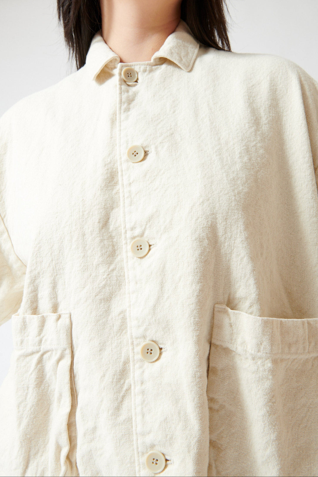 Lilly wearing Pas de Calais Natural Brushed Linen Cotton Twill Relaxed Coverall Jacket Natual front/detail view