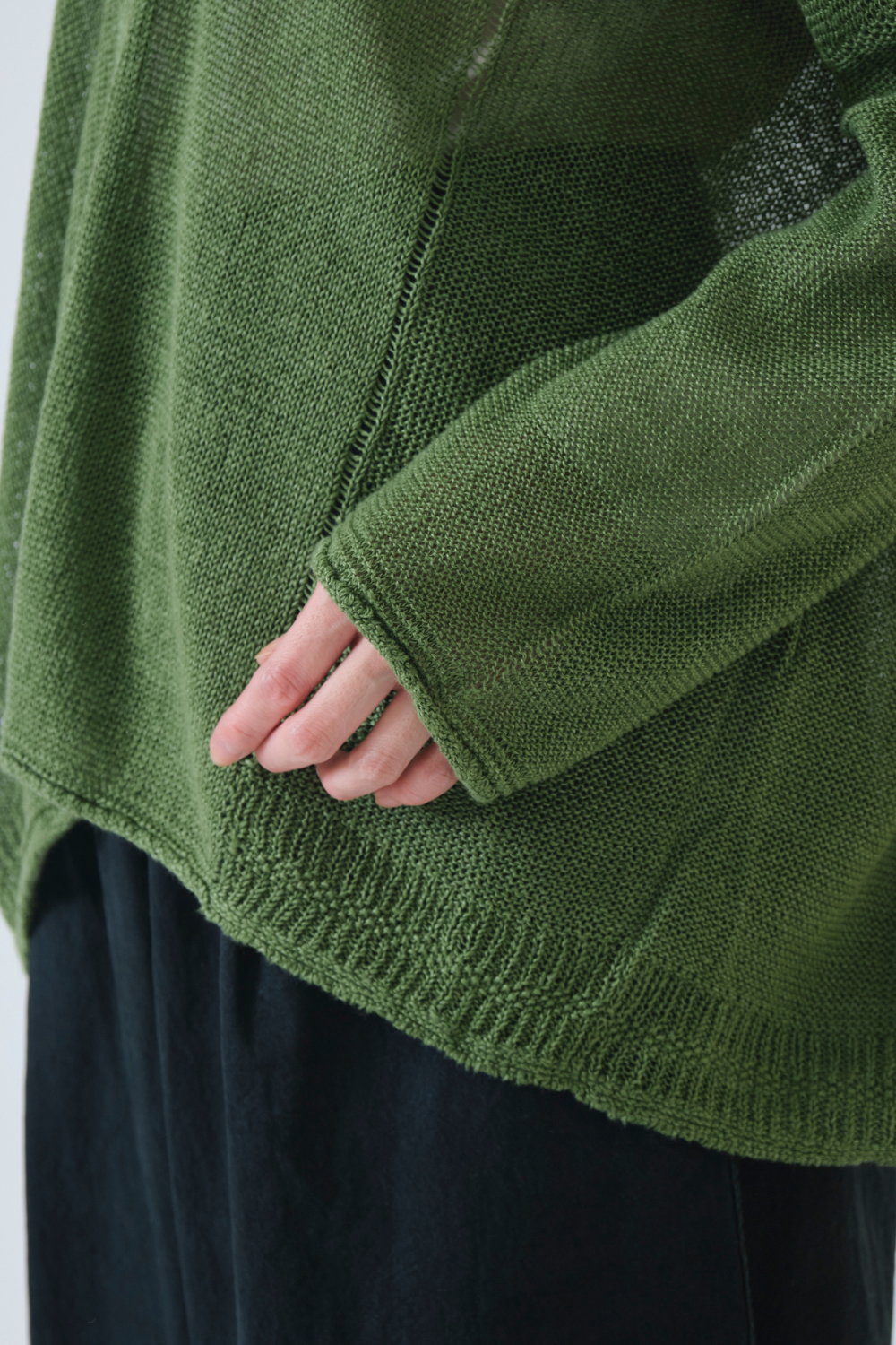 Model wearing Pas de Calais Normandy Linen V Neck Cardigan detail view