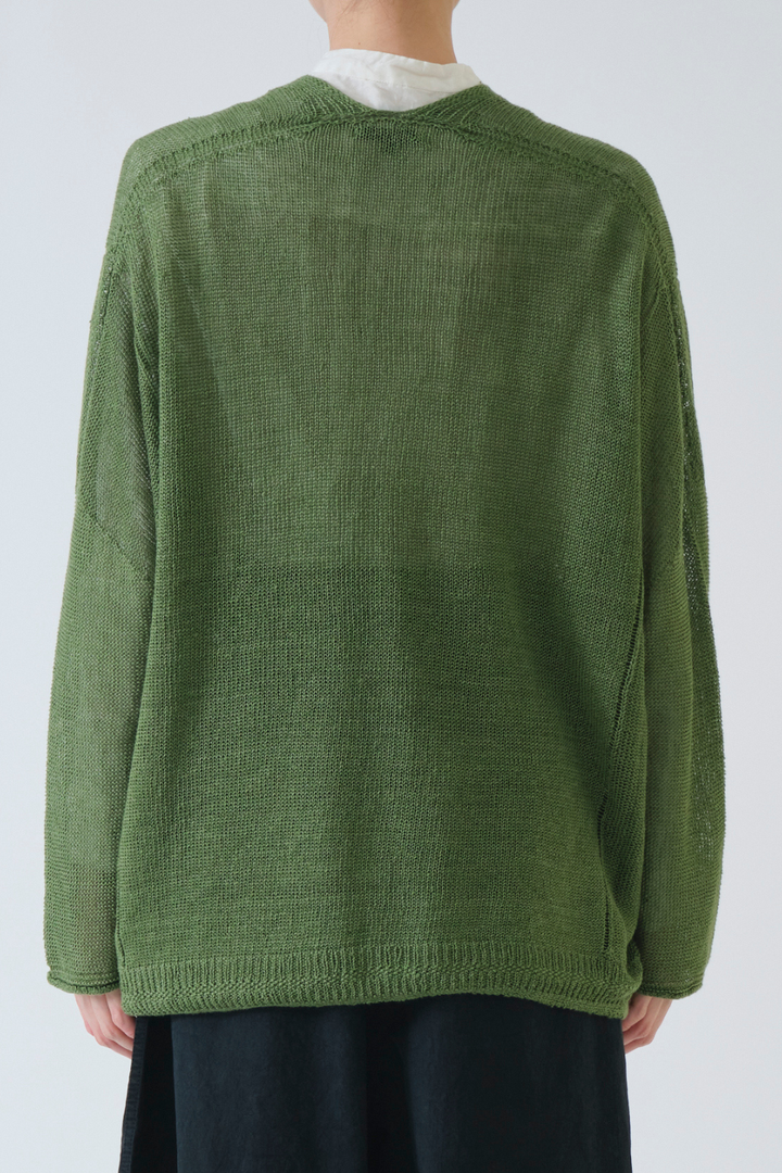 Model wearing Pas de Calais Normandy Linen V Neck Cardigan rear view