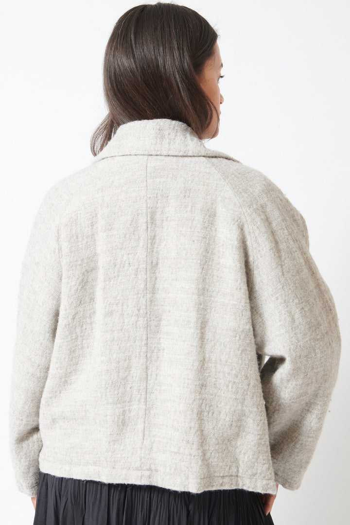 Model wearing Pas de Calais Shetland Wool and Normandy Linen Short Jacket rear view