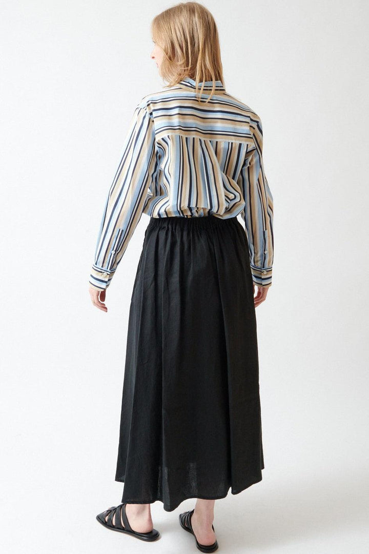 Madi wearing Rosso 35 Garment Dyed Half Elasticated Skirt rear view