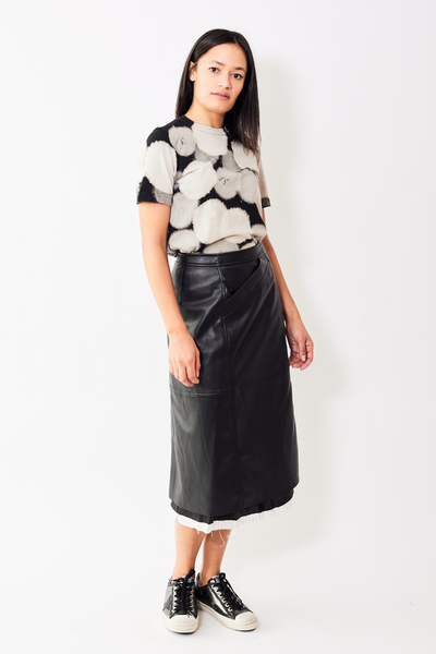 Model wearing Raquel Allegra Aurora Faux-leather skirt.