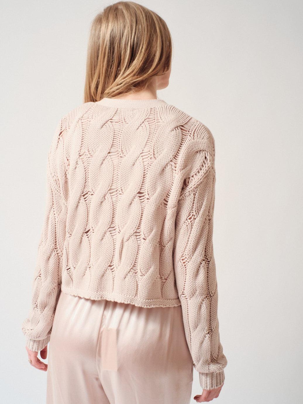 Madi wearing Sablyn Jolie D V Neck Cropped Cable Cardigan rear view