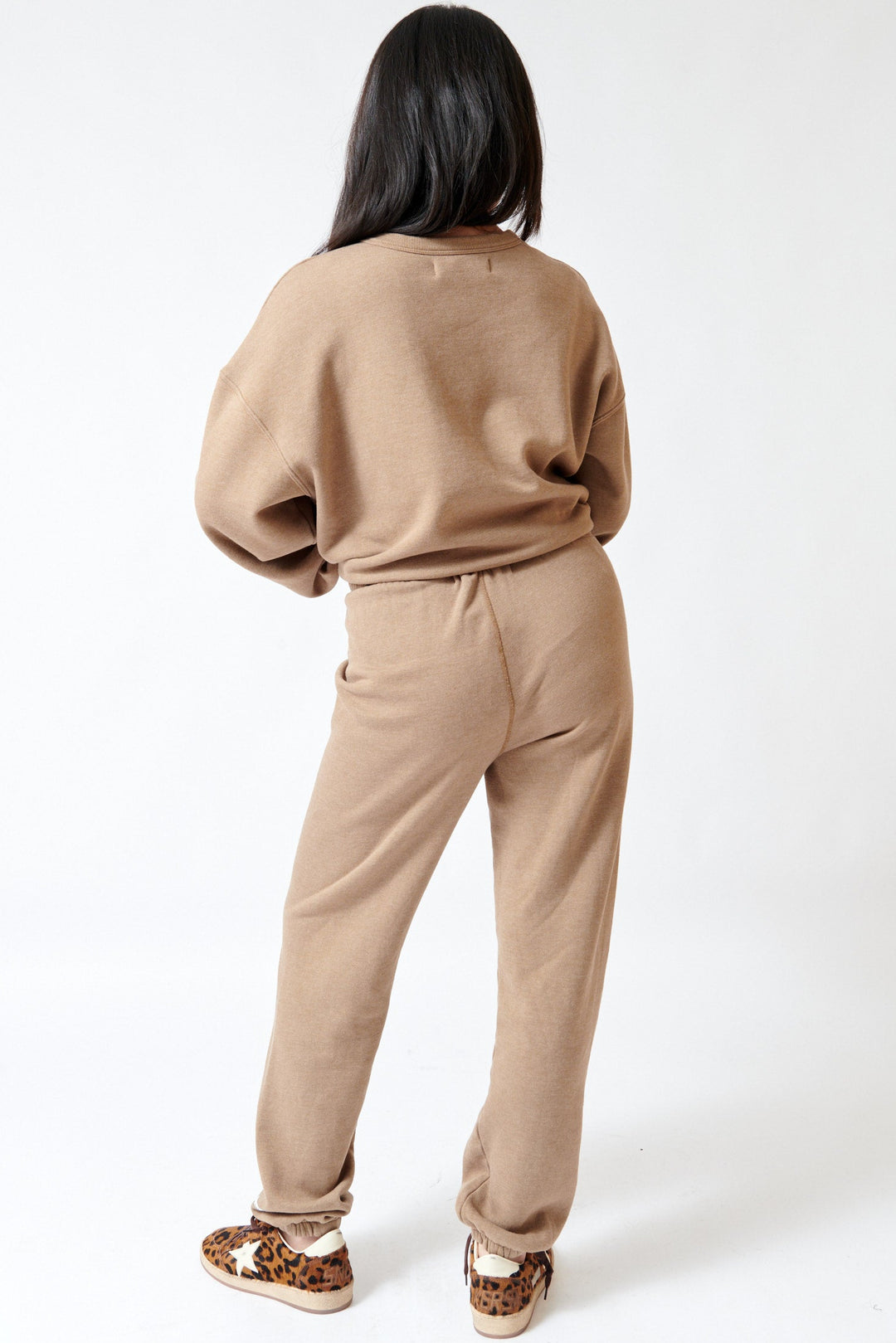 Lilly wearing SPRWMN Mini Logo Sweatpants rear view