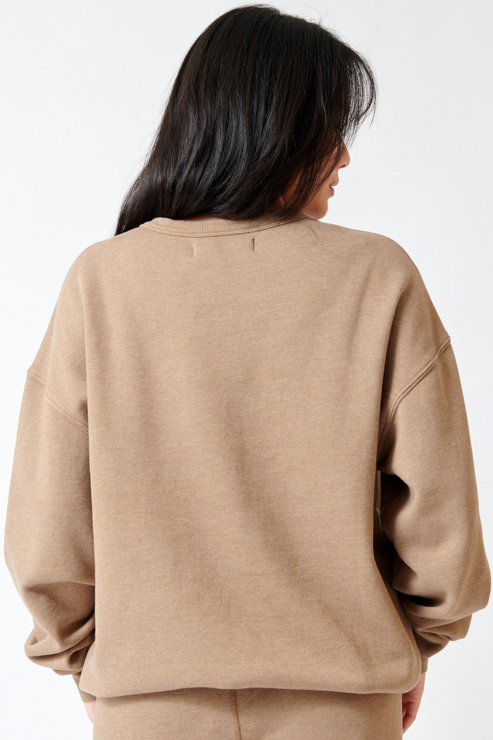 Lilly wearing SPRWMN Oversized Sweatshirt rear view