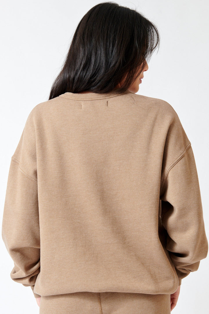 Lilly wearing SPRWMN Oversized Sweatshirt rear view