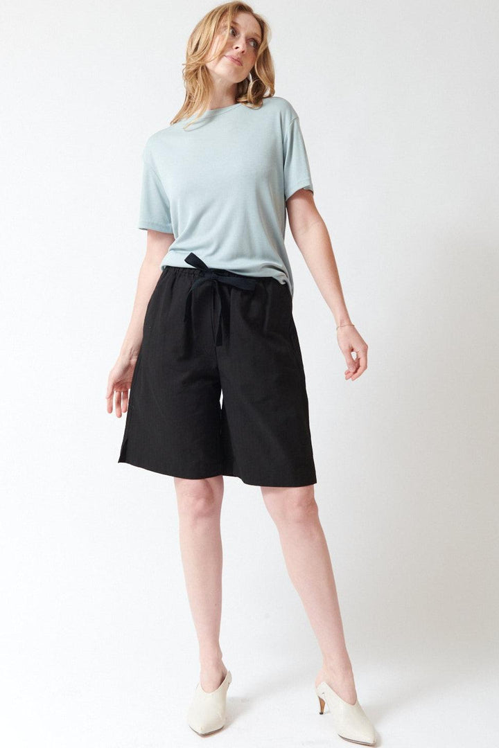 Madi wearing Studio Nicolson Demba Tonal Broken Twill Elasticated Waist Short front view