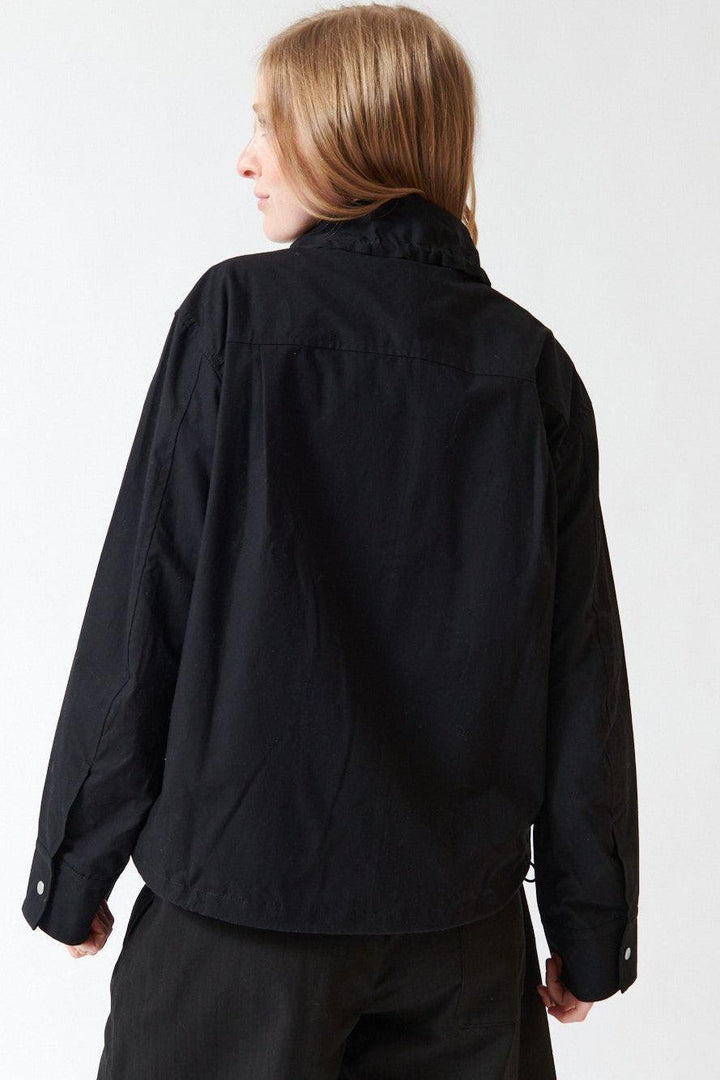 Madi wearing Studio Nicolson Lismore Noisy Cotton Zip Thru Jacket rear view