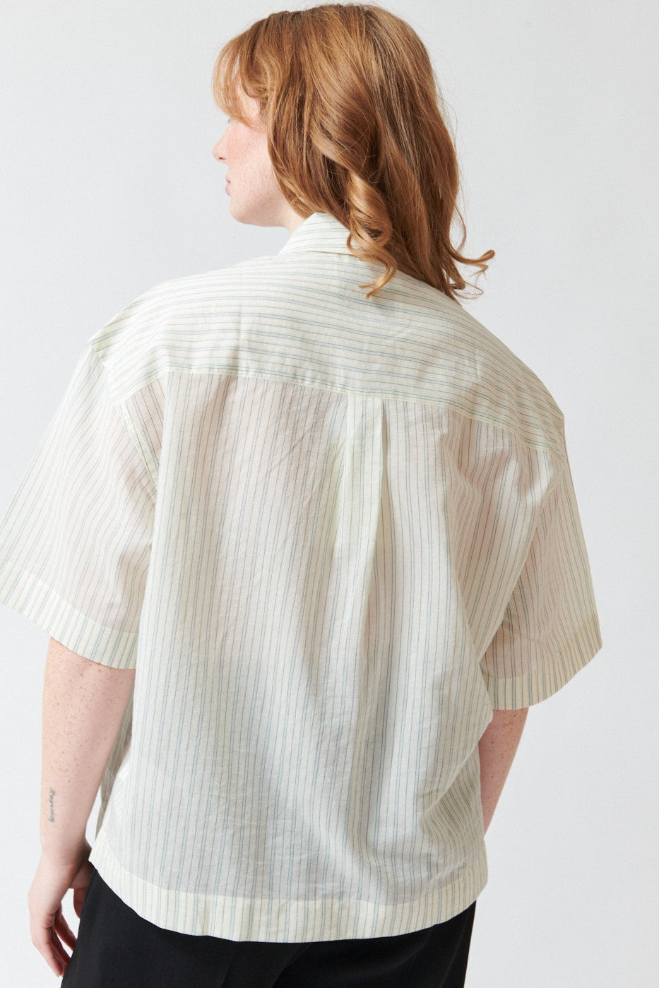 Waverly wearing Studio Nicolson Merle Cotton Silk Stripe Short Sleeve Shirt rear view