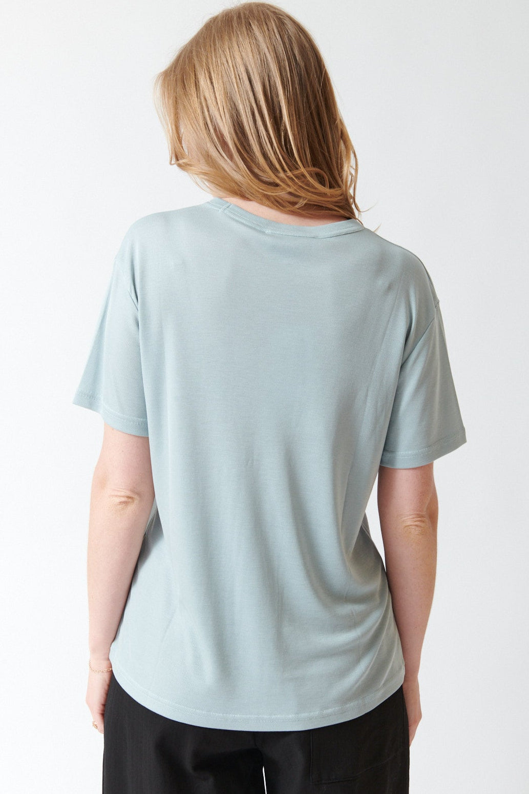 Madi wearing Studio Nicolson Rond Rib Lyocell Jersey Short Sleeve Tee rear view