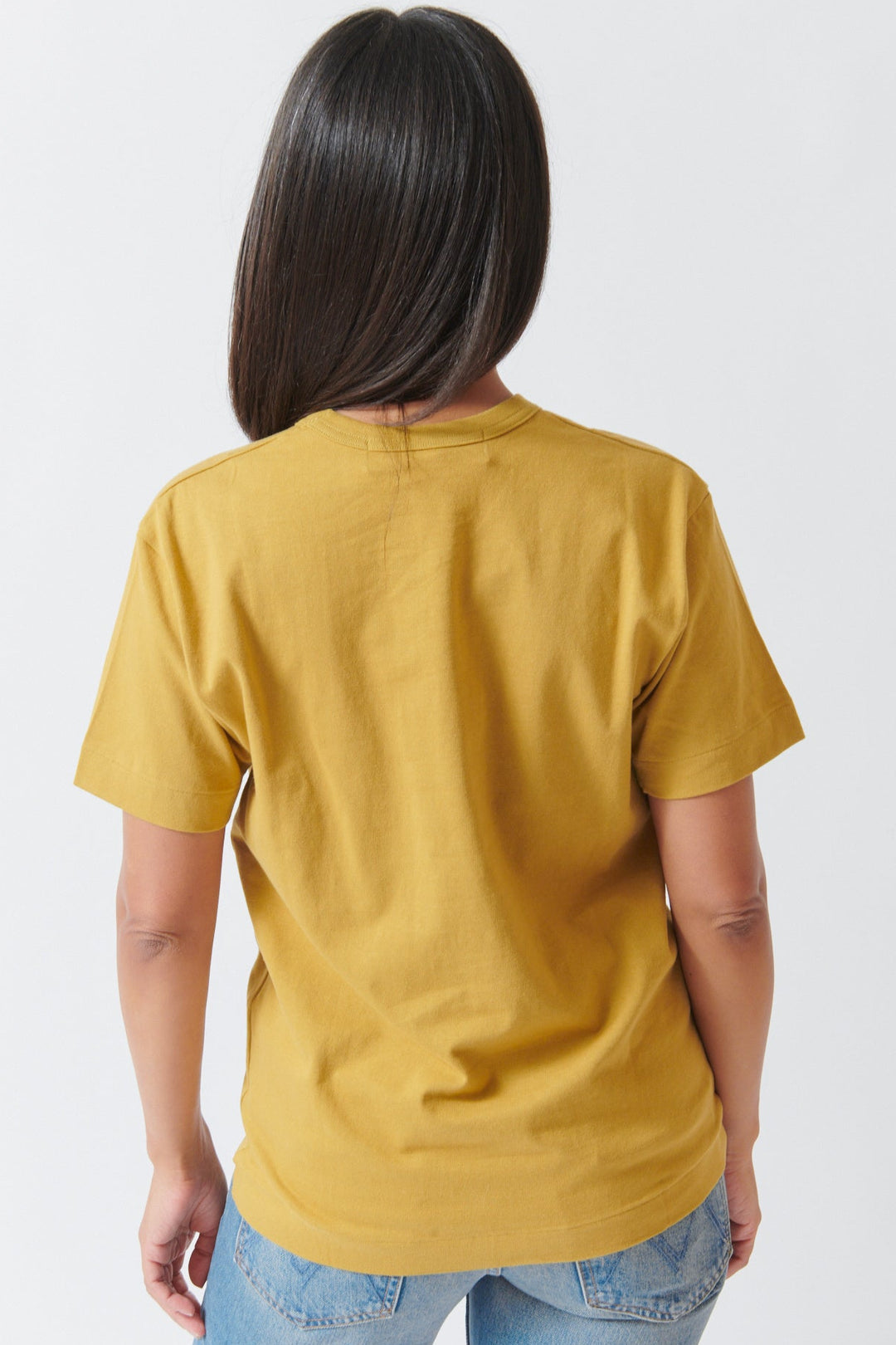 Amanda wearing Comme des Garçons PLAY Small Red Emblem T Shirt Olive Small Red Heart rear view