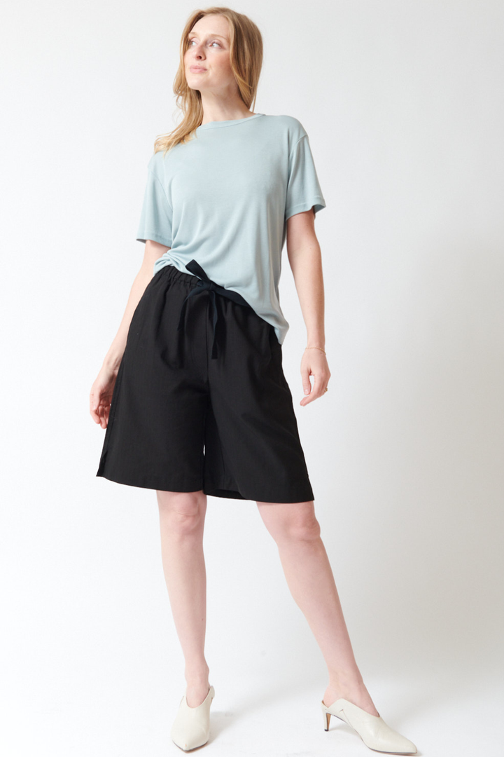 Madi wearing Studio Nicolson Demba Tonal Broken Twill Elasticated Waist Short front view