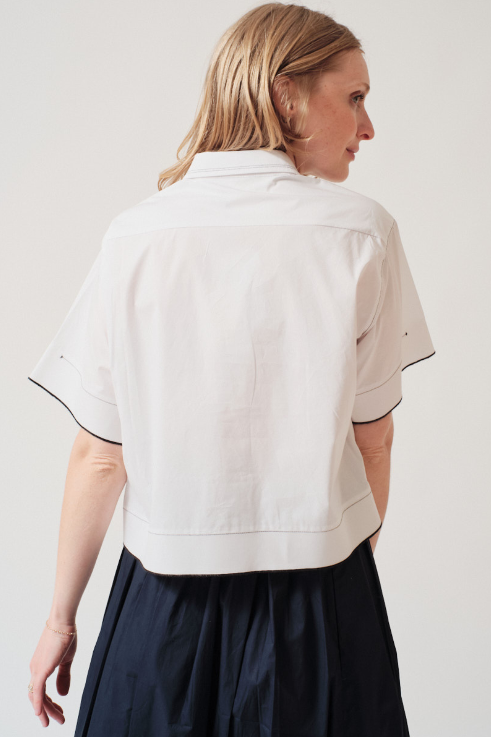 Madi wearing Tela Gimmy Shirt Striped rear view
