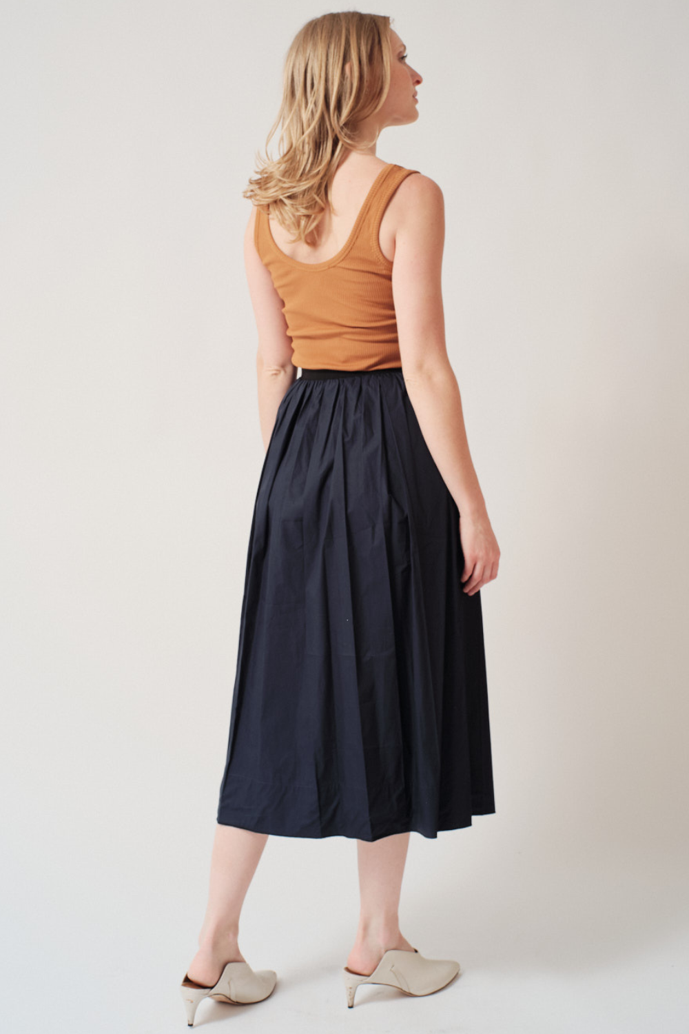 Madi wearing Tela Leda Skirt rear view