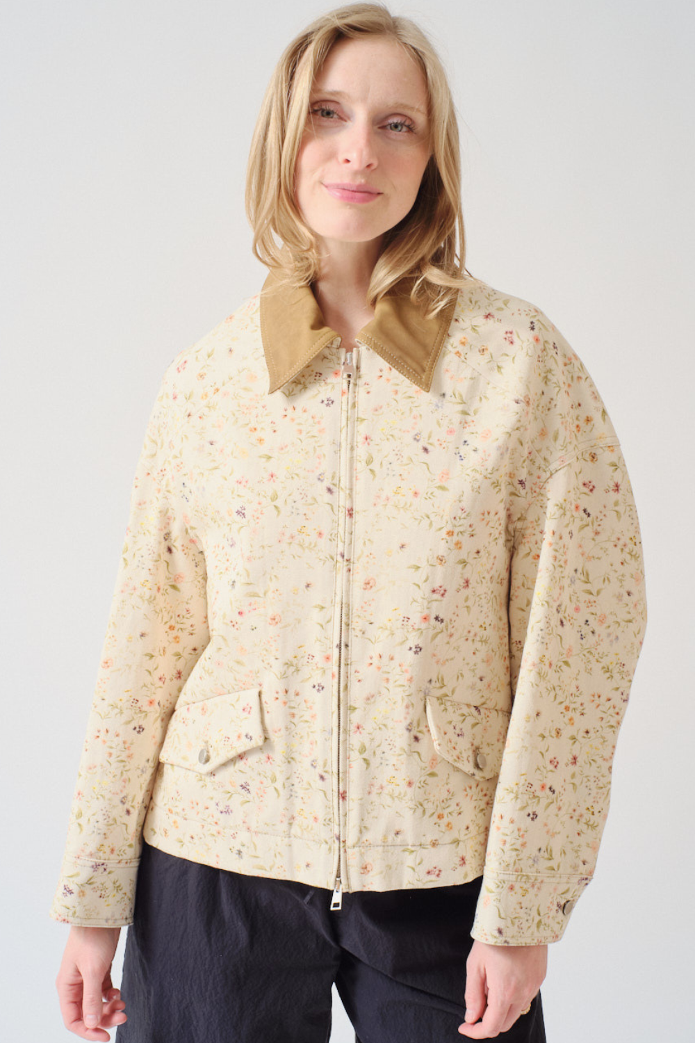 Madi wearing Tela Bubble Light Jacket front view