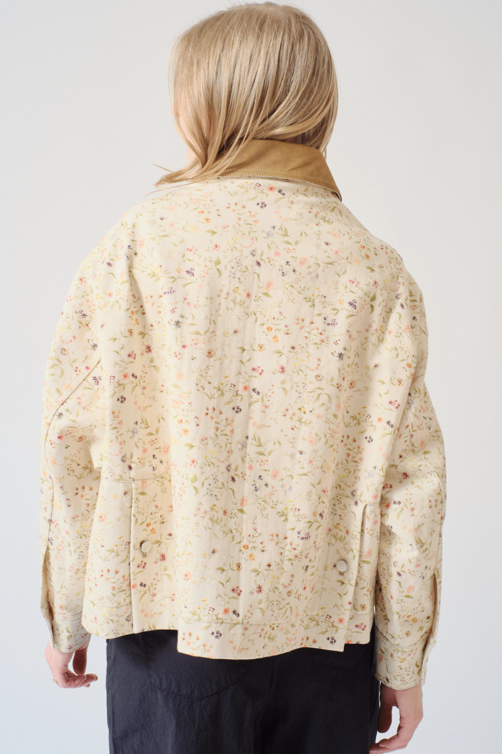 Madi wearing Tela Bubble Light Jacket rear view