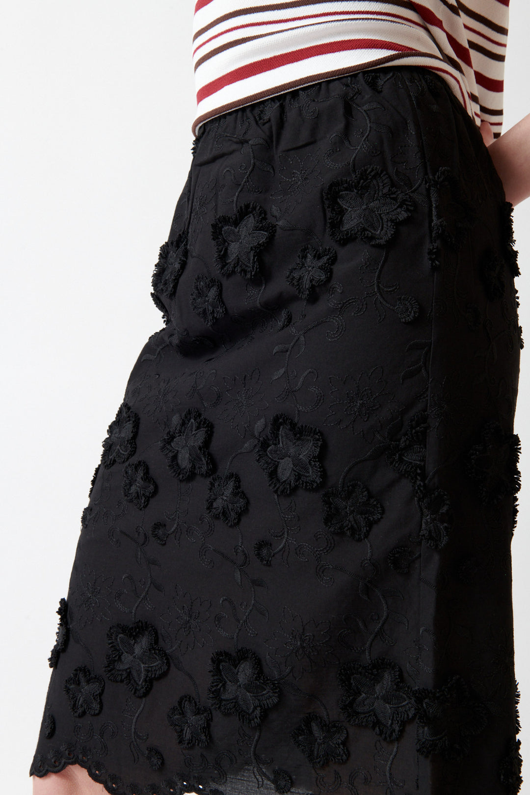 Angela wearing The Garment Fleur Slip Skirt detail view