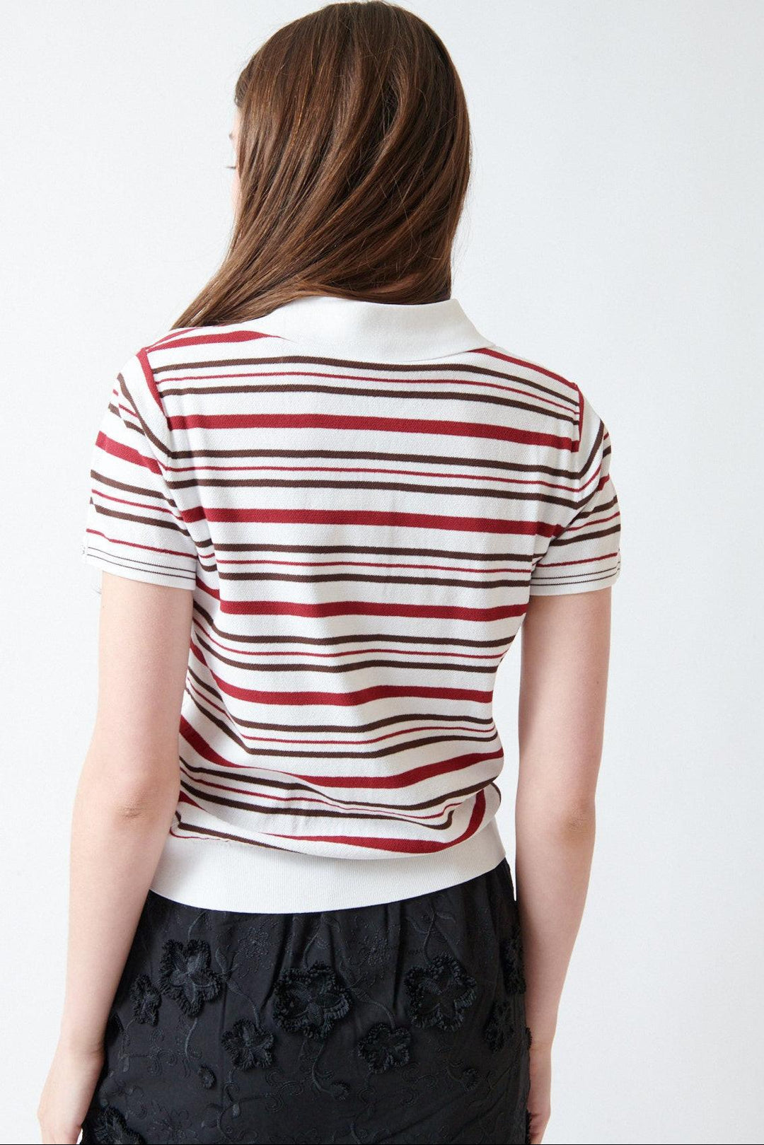 Angela wearing The Garment Madison Button Polo rear view