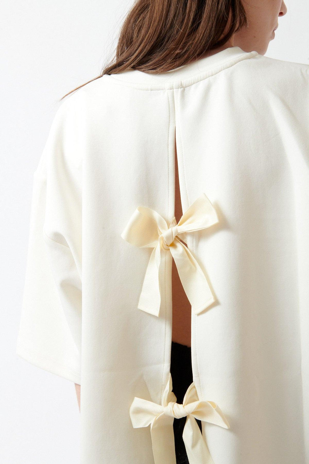 Angela wearing The Garment TG Bow Tee rear/detail view
