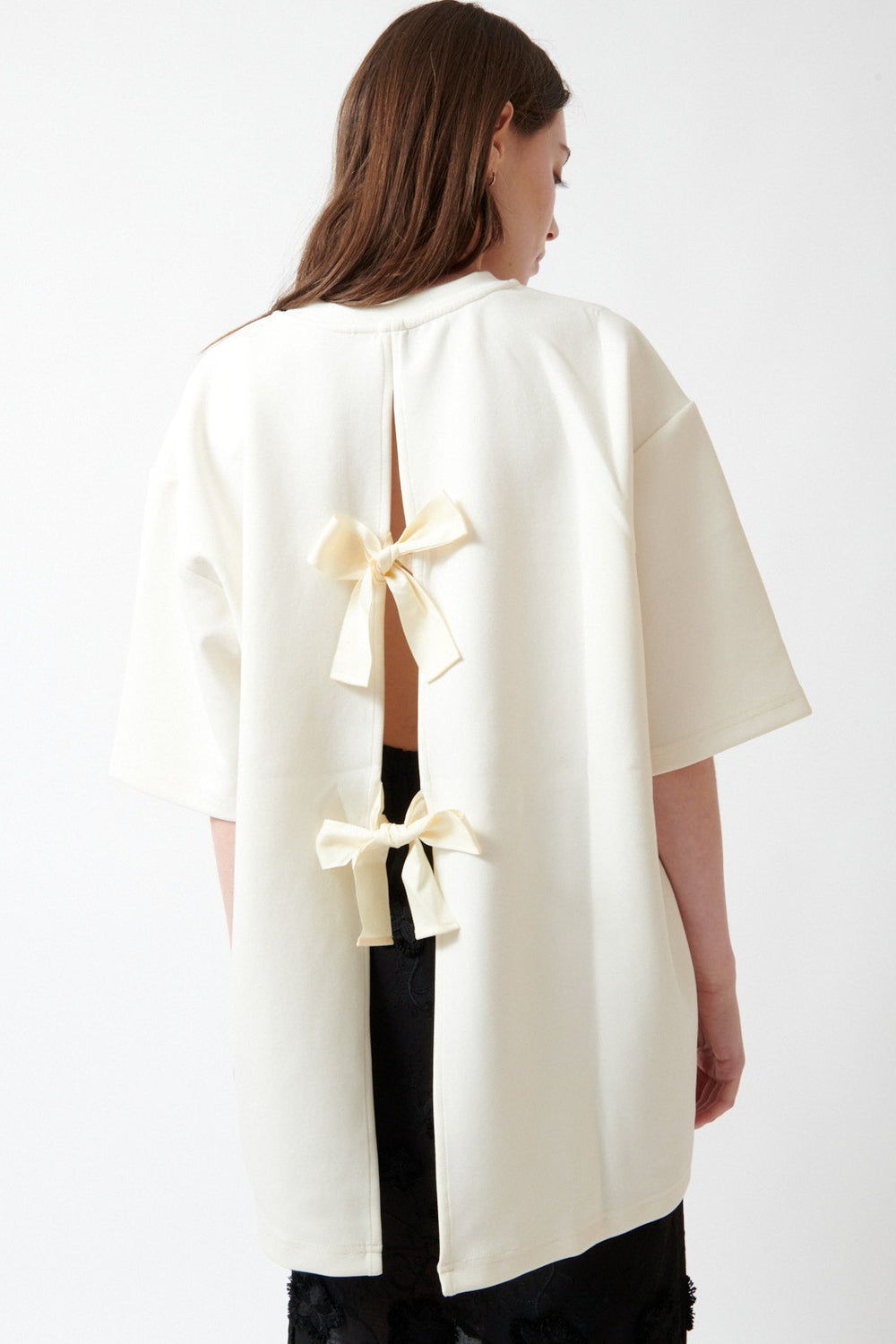 Angela wearing The Garment TG Bow Tee rear view