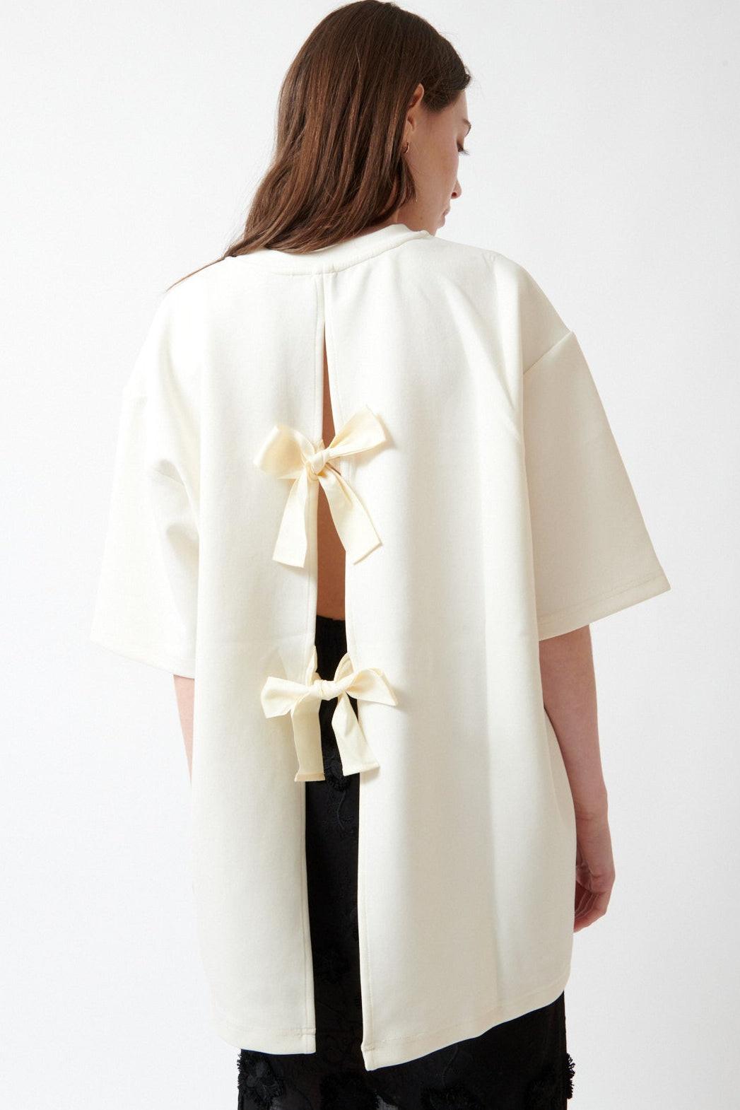 Angela wearing The Garment TG Bow Tee rear view