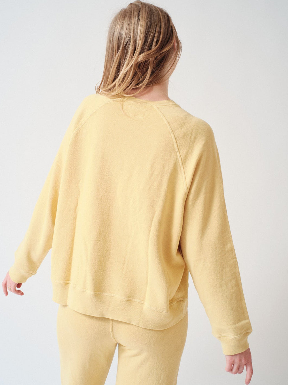 Madi wearing The Great The Slouch Sweatshirt rear view