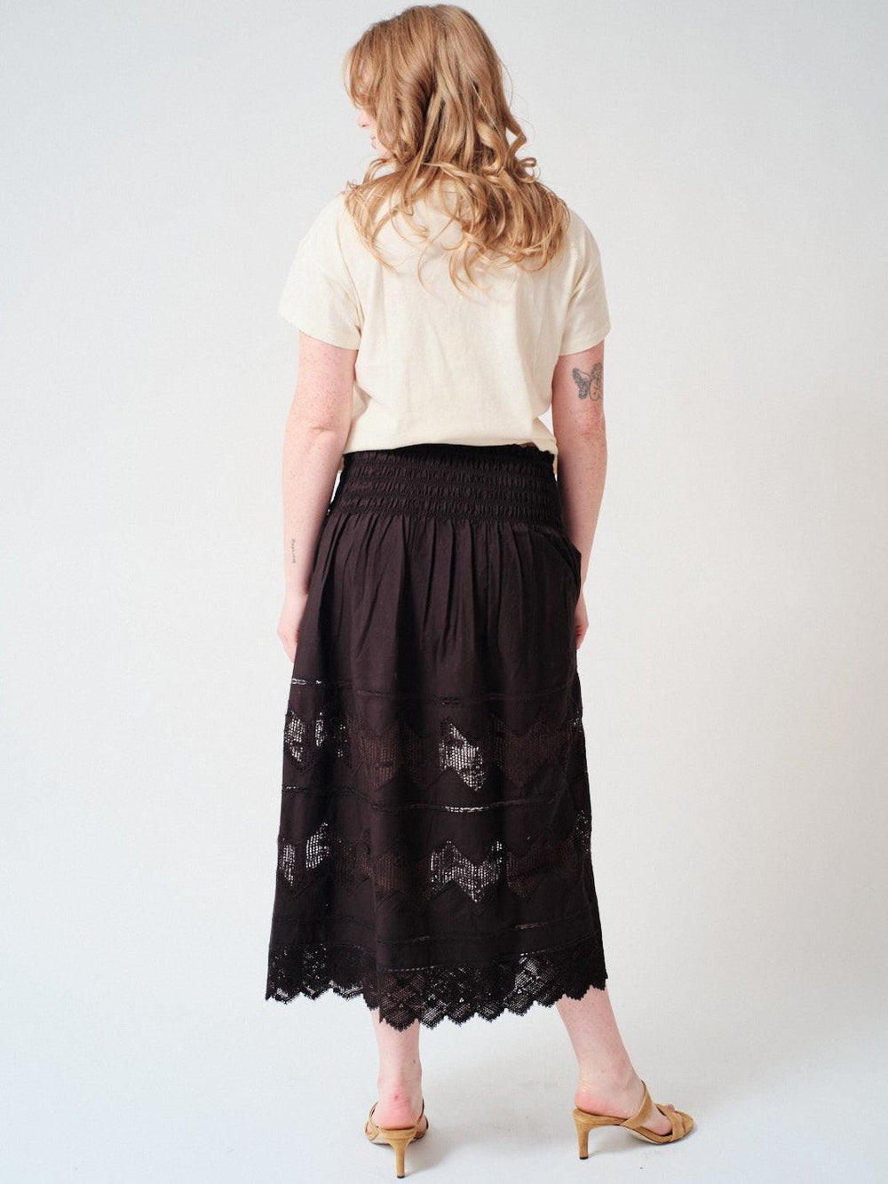 Waverly wearing The Great The Rosette Crochet Canary Skirt rear view