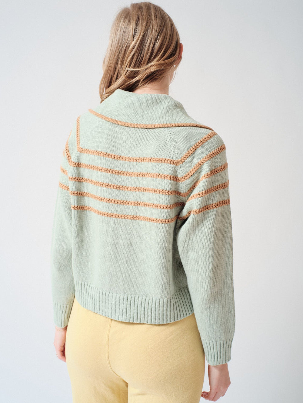 Madi wearing The Great The Scholar Cardigan With Crochet Stripes rear view