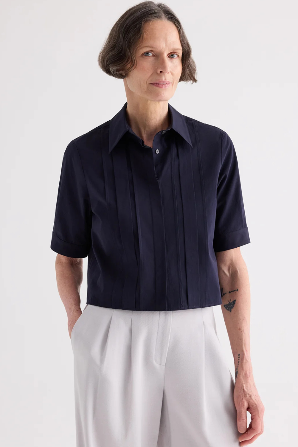 Model wearing TWP Short Lived Placket Shirt With Cherry Pleats Midnight front view
