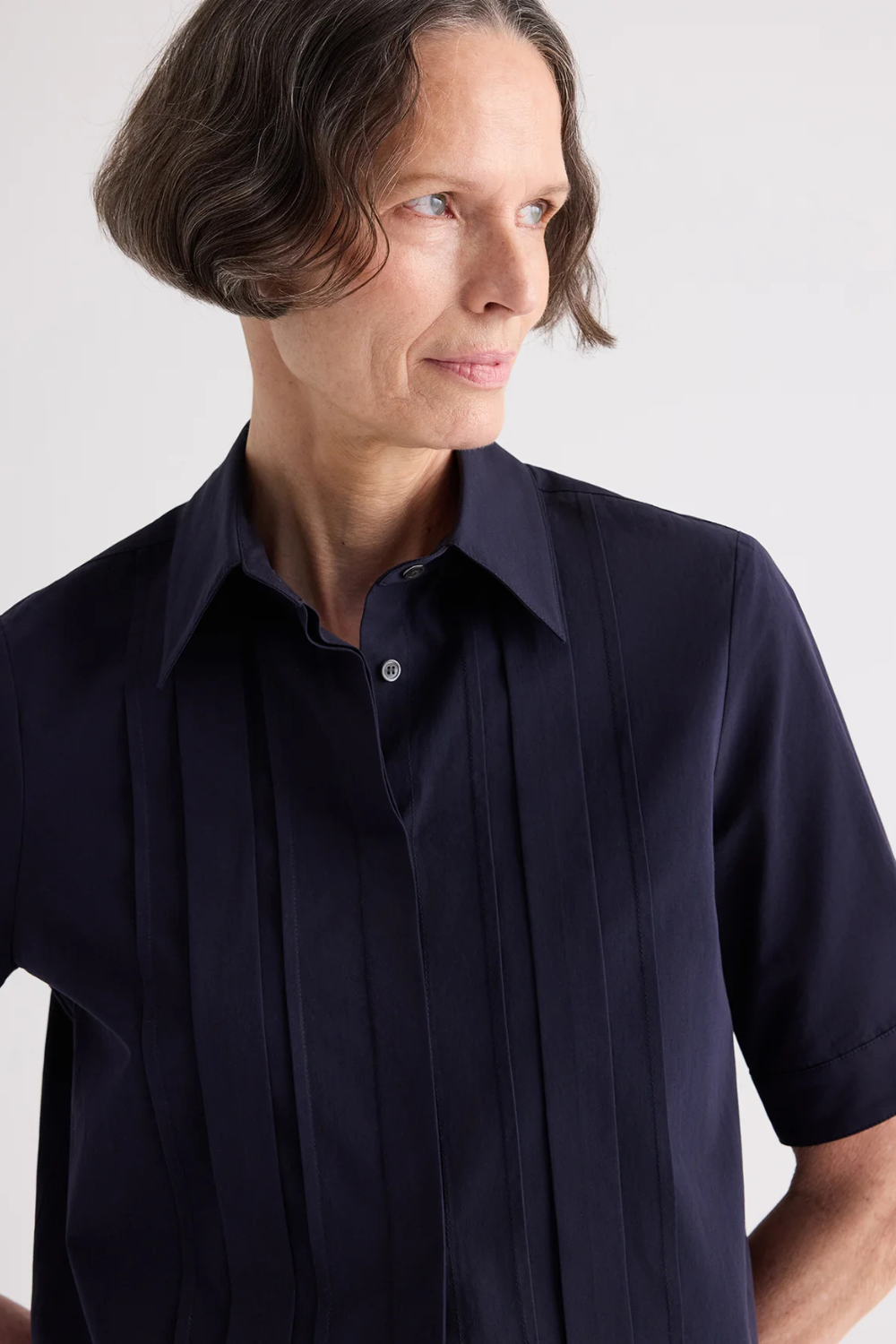 Model wearing TWP Short Lived Placket Shirt With Cherry Pleats Midnight front/detail view