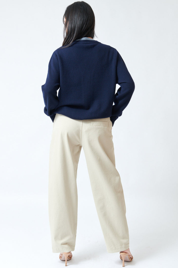 Lilly wearing Tela Cosmo Trousers rear view