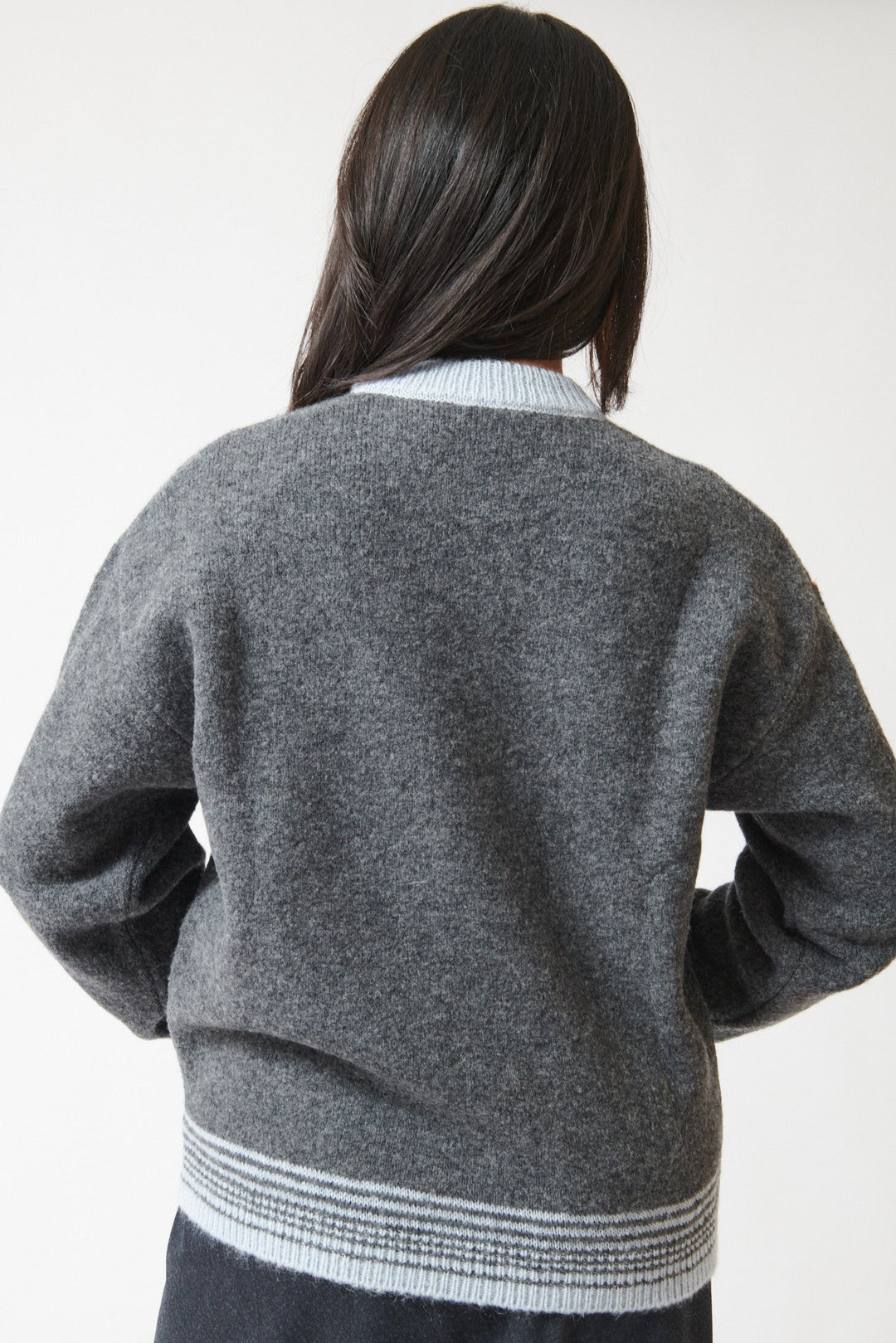 Lilly wearing Tela Engin Sweater rear view