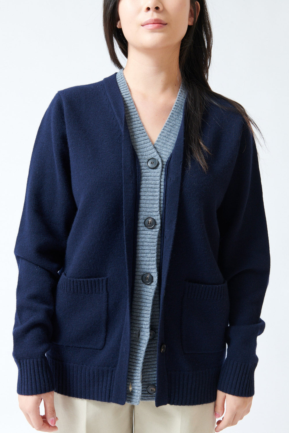 Lilly wearing Tela Fei Cardigan front detail view