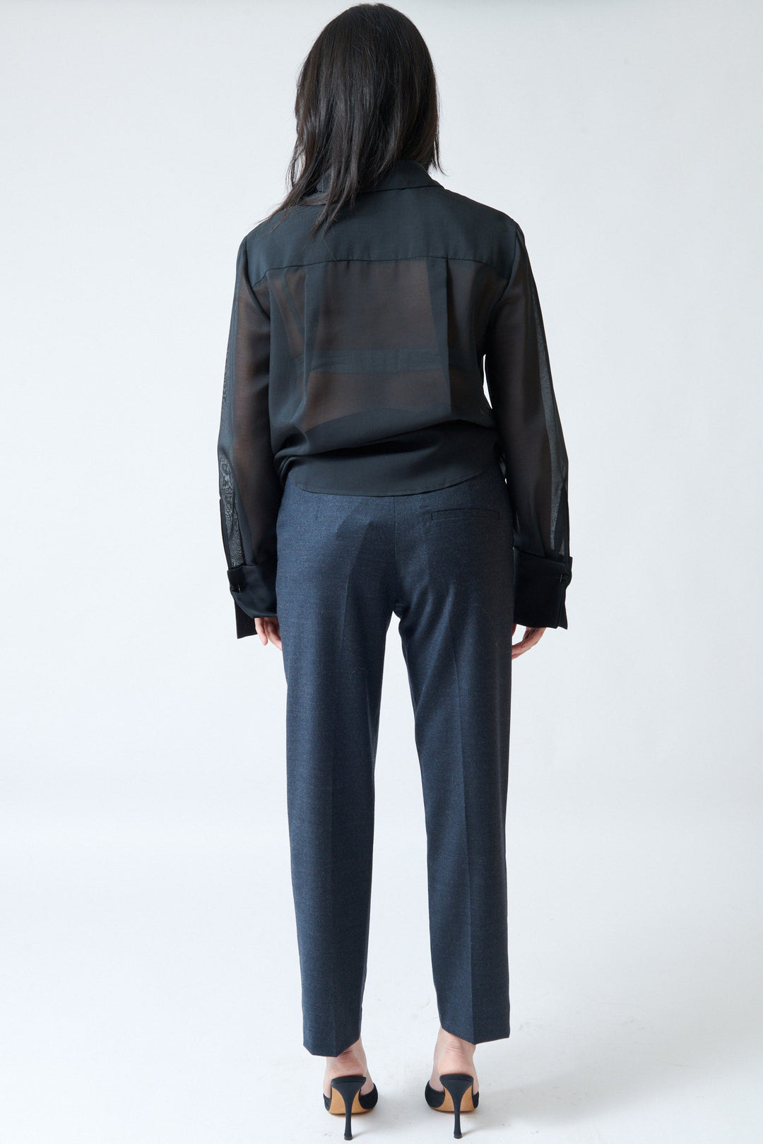 Lilly wearing Tela Finn Trousers charcoal rear view