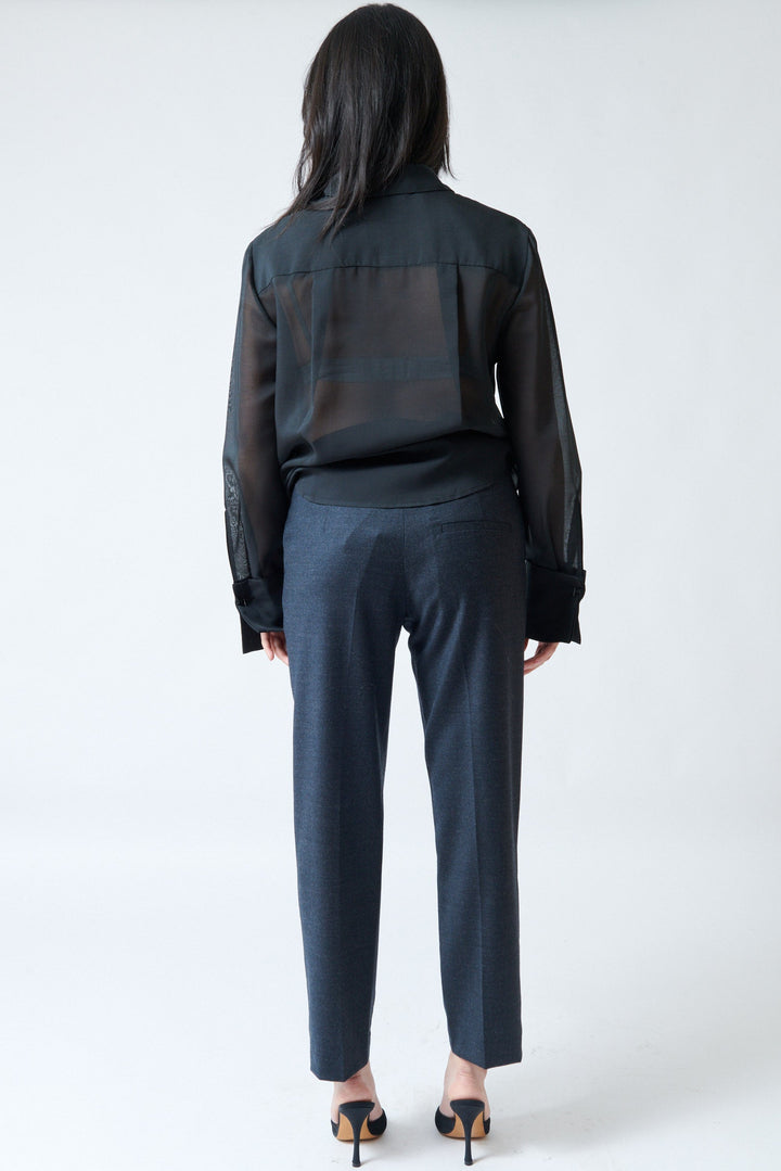 Lilly wearing Tela Finn Trousers charcoal rear view