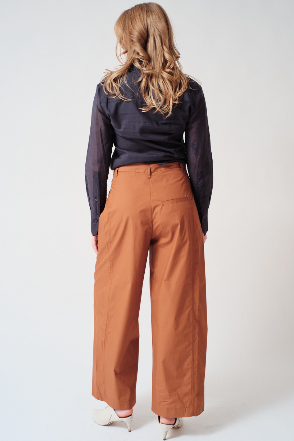 Waverly wearing Tela Lucio Trousers rear view