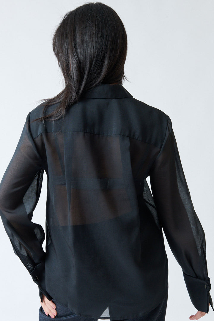 Lilly wearing Tela Opal Shirt rear view